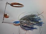 2 1/2 oz. this was my vision of what I wanted to make for stripers, .040blades,.051gauge wire,8/0 hooks, doubled skirts, Total wgt. 3oz.plus!